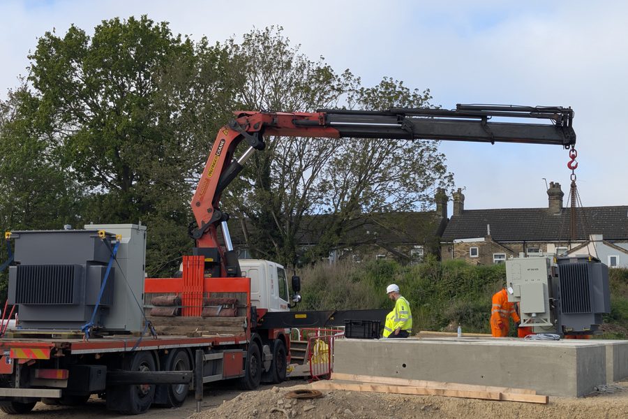 HIAB crane offloading a 1000kVA package substation onto its plinth at an industrial park in Newcastle